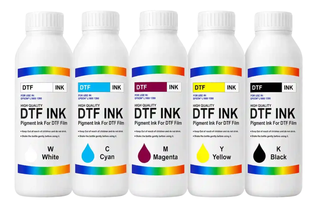 CMYK and white DTF printing ink bottles.