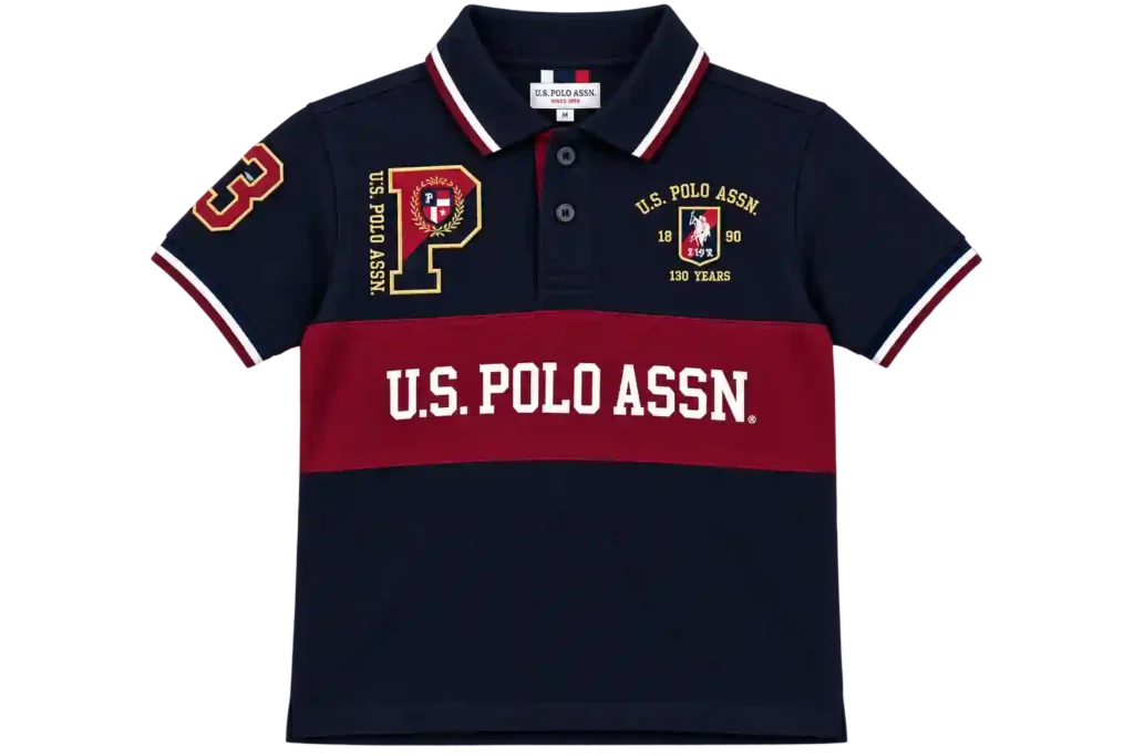 Navy blue kids polo shirt with red and white chest detailing.