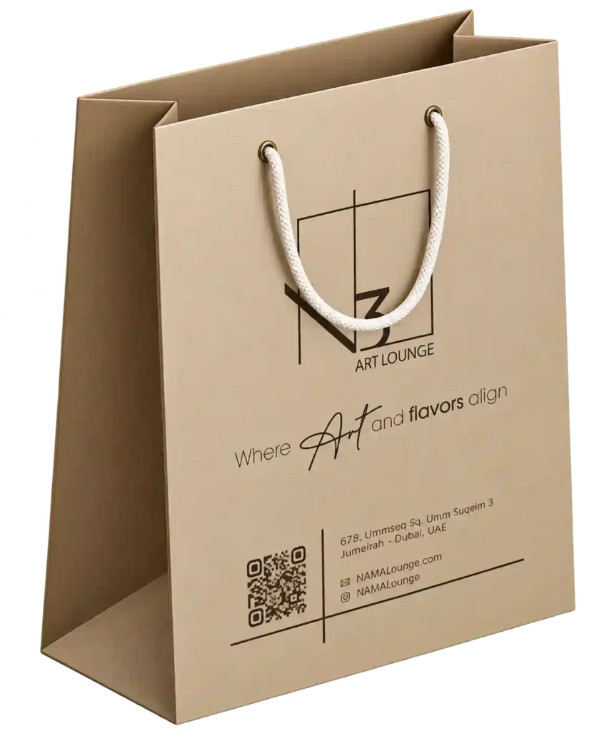 Kraft paper shopping bag with rope handles and printed branding.